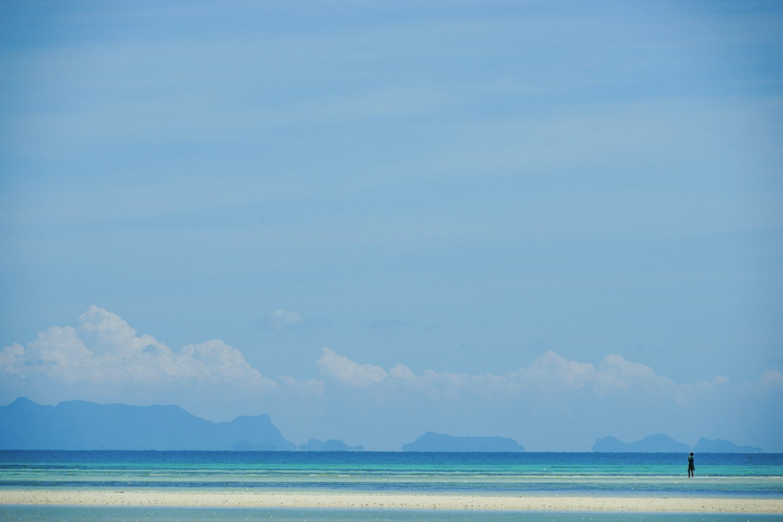 The Gulf of Thailand lying almost flat off Koh Samui in the dry season, with distant islands on the horizon