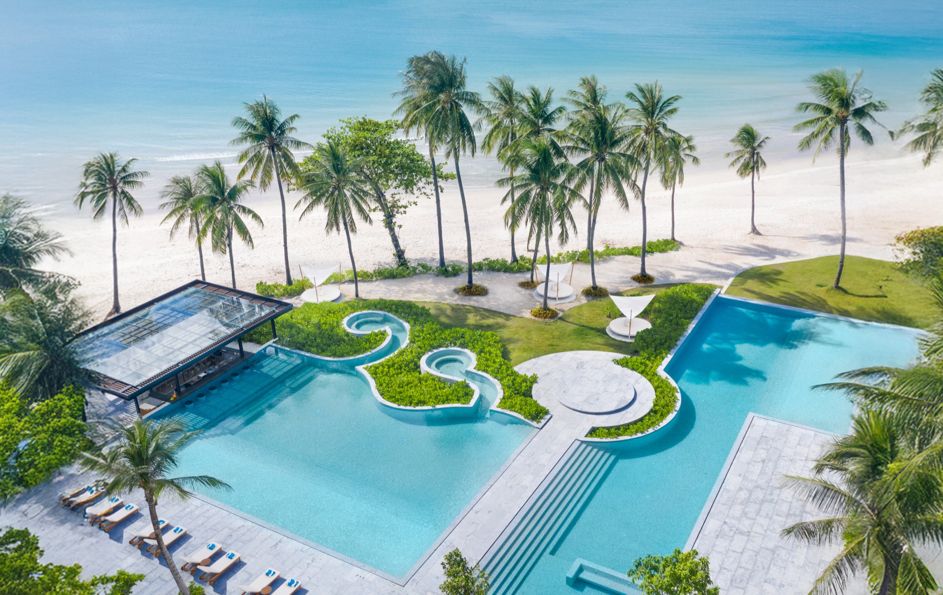 The ocean-view sala pavilion on the lawn at Centara Reserve Samui, set with chairs for a wedding ceremony above Chaweng Beach